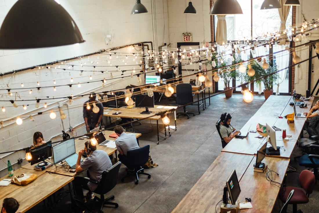 People working in a busy co-working space