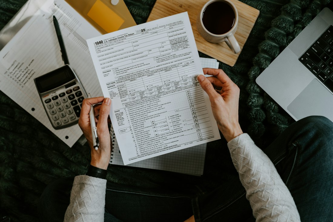 Tax forms being reviewed on a desk