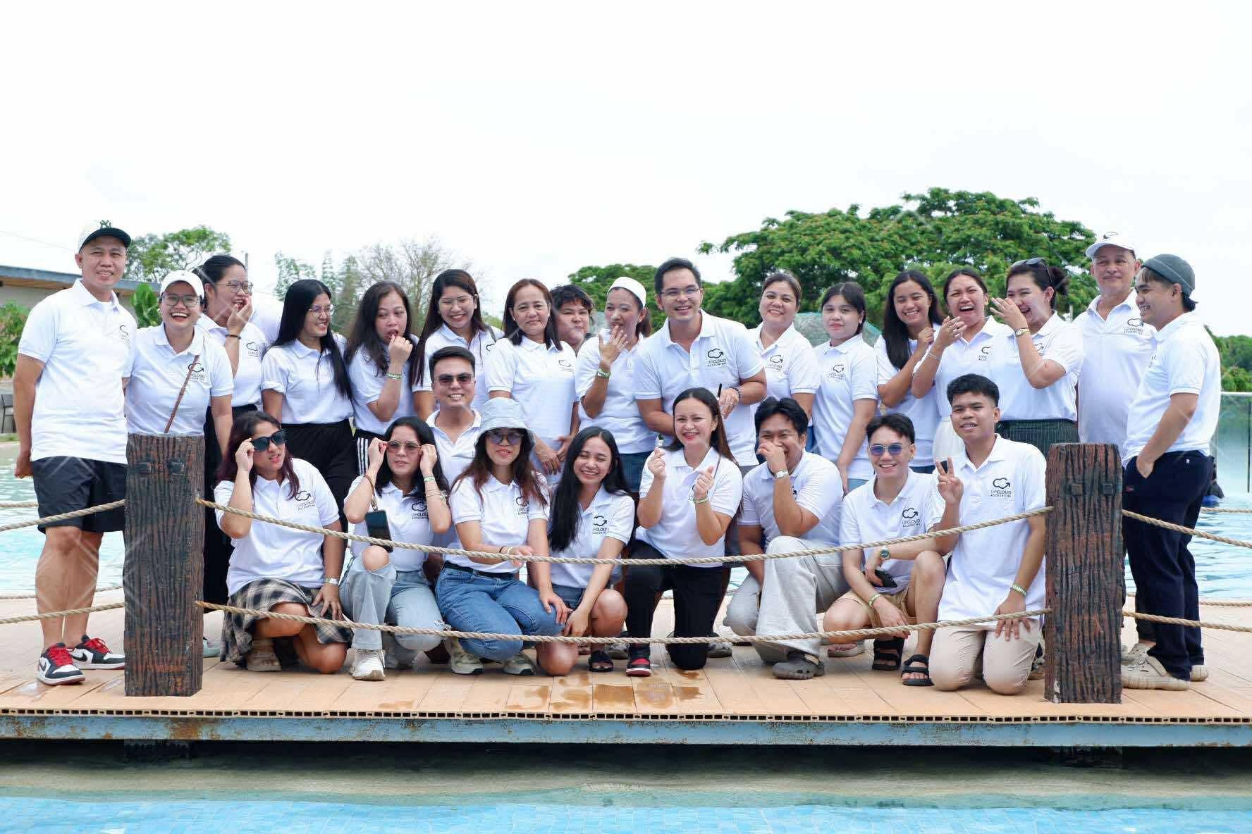 The Upcloud team together in branded Upcloud shirts